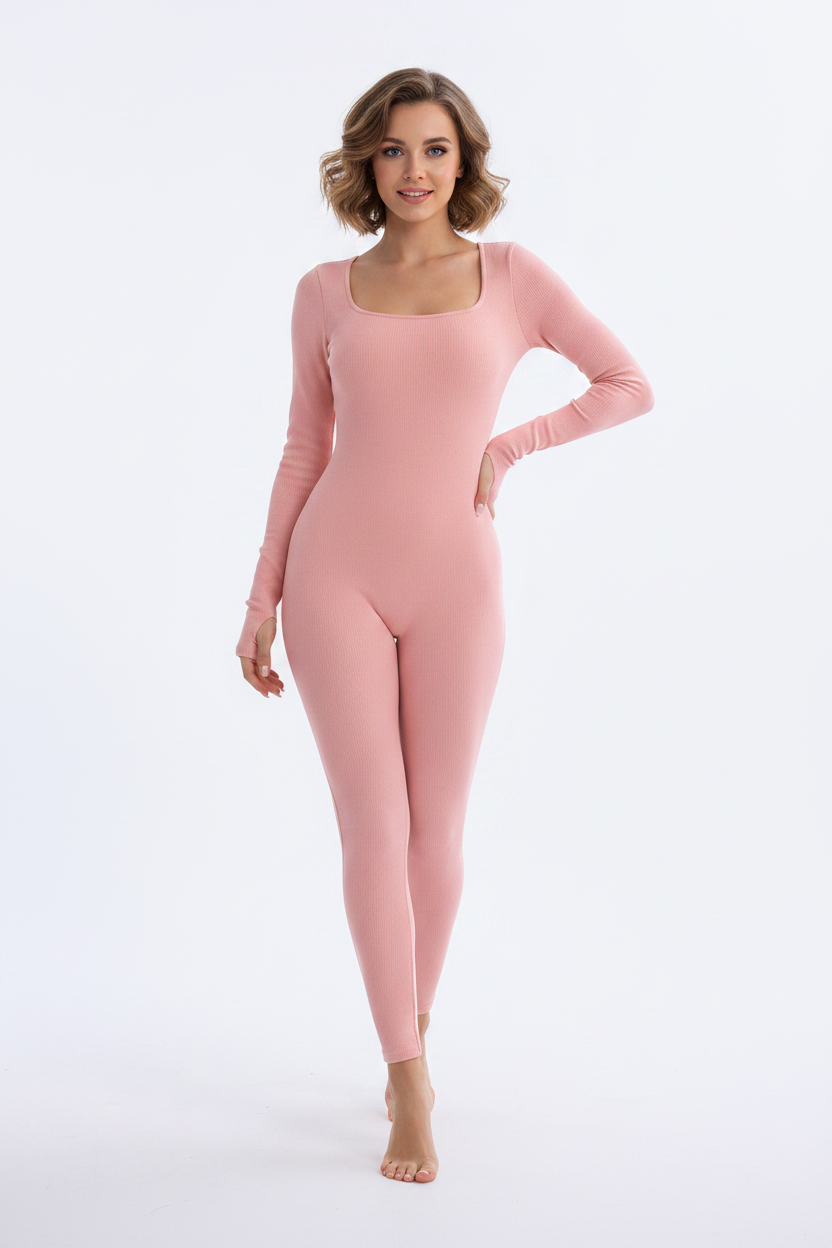 Lifestyle shot of a woman in a purple square neck jumpsuit with cropped blazer and heeled boots for night out.
