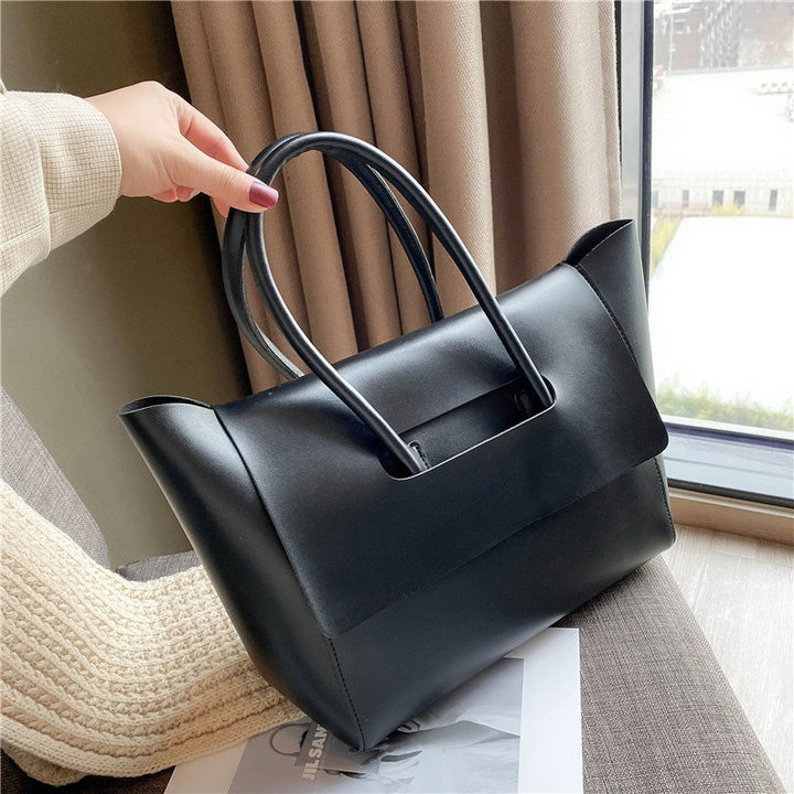 women shoulder bag front profile highlighting retro inspired square silhouette