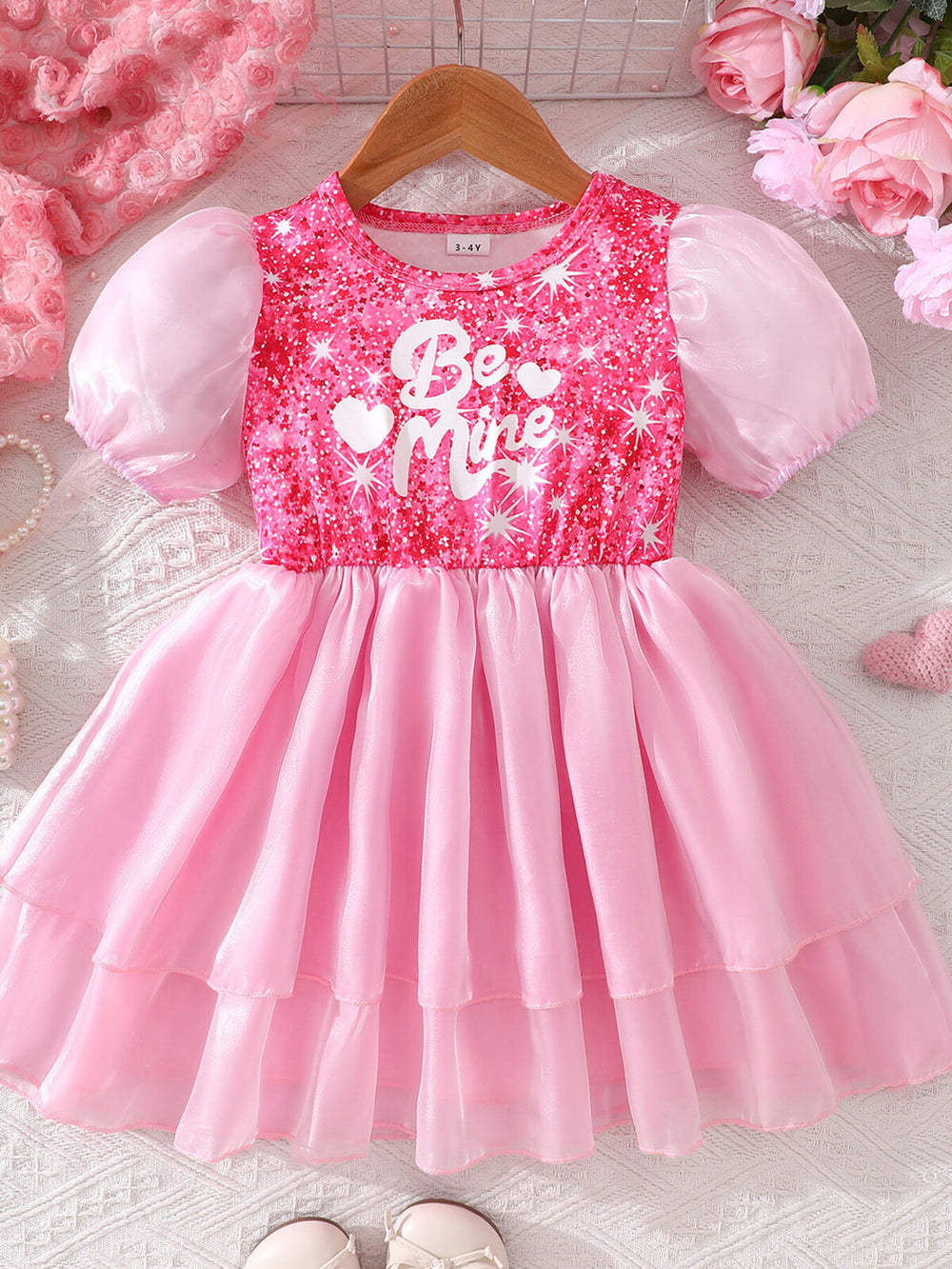 Pink puff sleeve dress for girls styled for birthday parties, holiday photos, and special celebrations