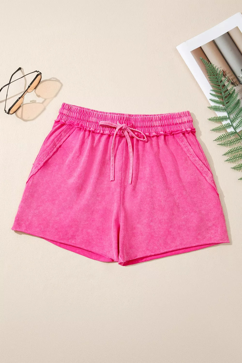 cotton drawstring shorts women flat lay showing soft-wash finish and simple design for capsule wardrobe basics
