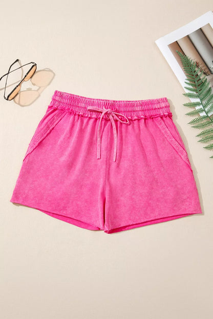 cotton drawstring shorts women flat lay showing soft-wash finish and simple design for capsule wardrobe basics

