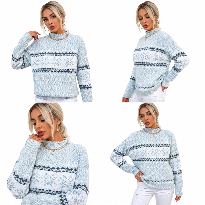 Woman wearing a light blue patterned sweater with white pants on a white background
