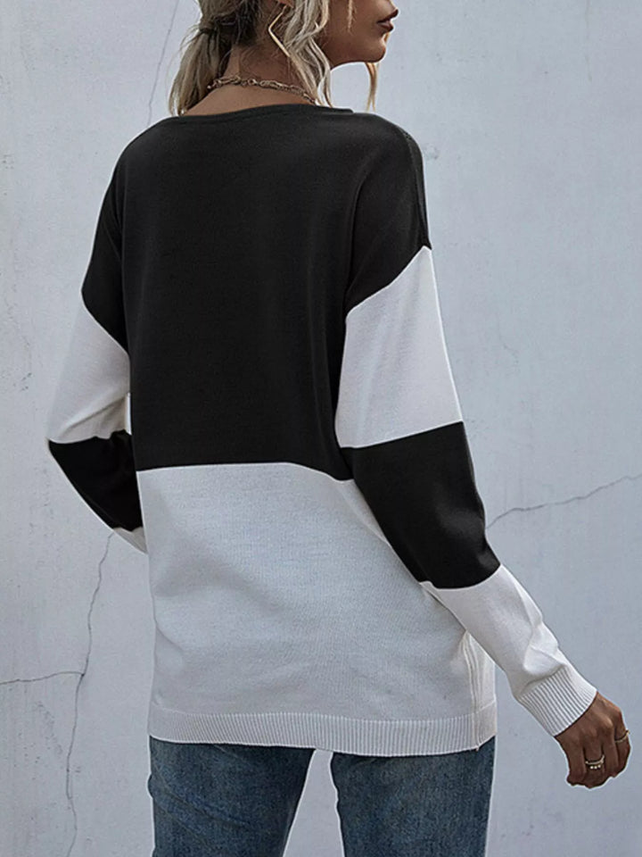 olor block sweater styled with jeans casual look