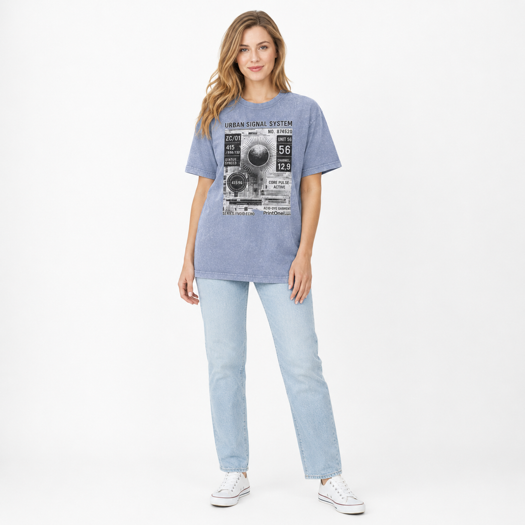 Woman wearing a vintage blue 90s streetwear T shirt with Urban Signal System graphic, light jeans and white sneakers.