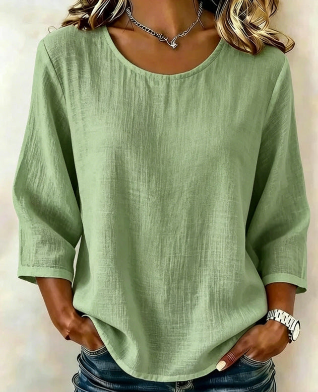 Product image showing casual crew neck top details and solid-color styling, displayed clearly for design detail for shoppers.