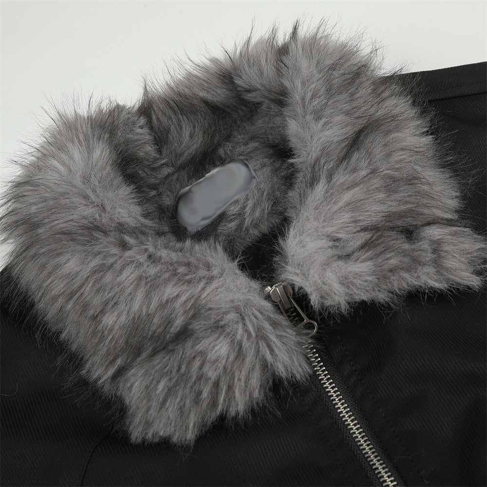 Close view of the grey faux fur collar on the black bomber jacket, showing the collar texture, silver zipper and black fabric