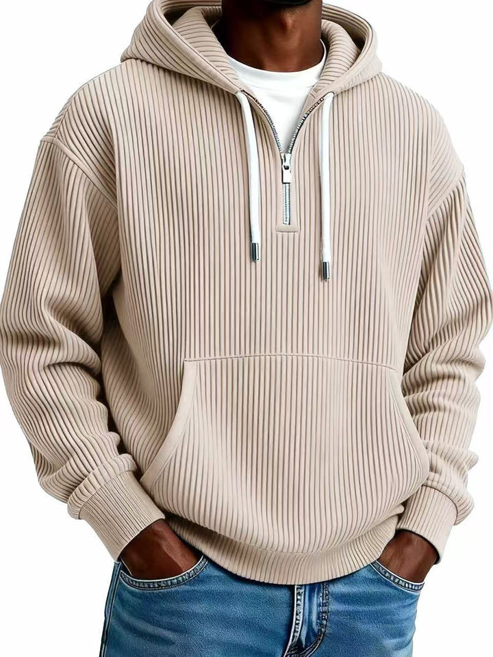 Beige ribbed hoodie worn by a person on a white background