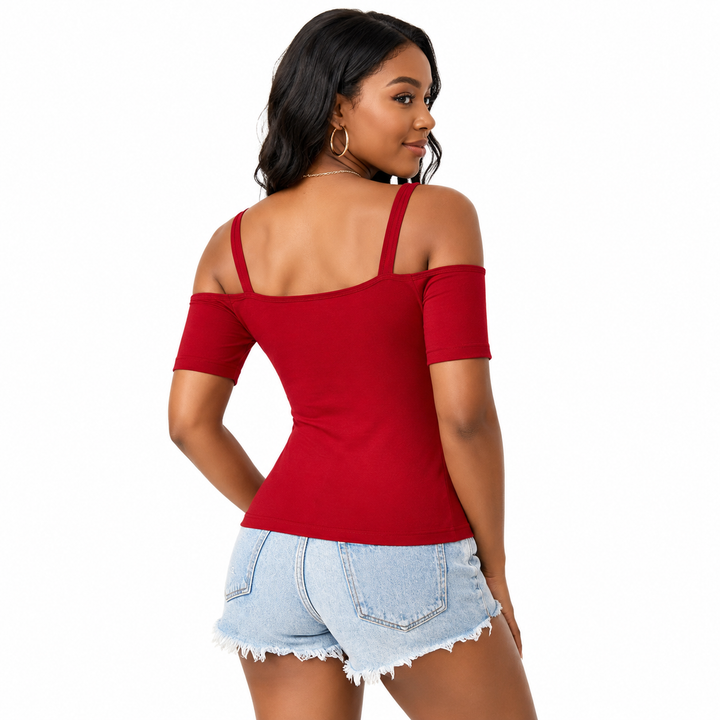 A woman wearing a red cold-shoulder short-sleeve top and light blue denim shorts, shown from the back against a plain white background.