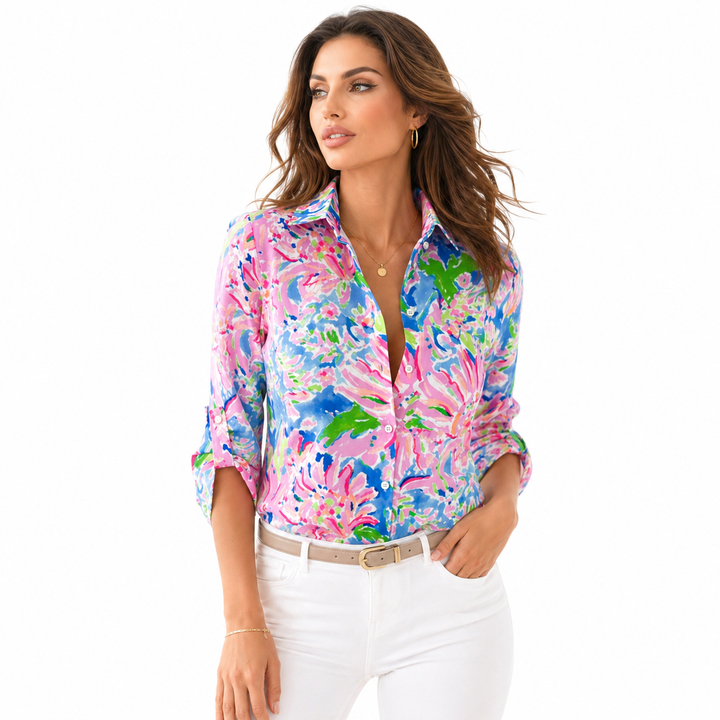 Model in a floral blouse with relaxed sleeves and a neat tucked-in styling idea