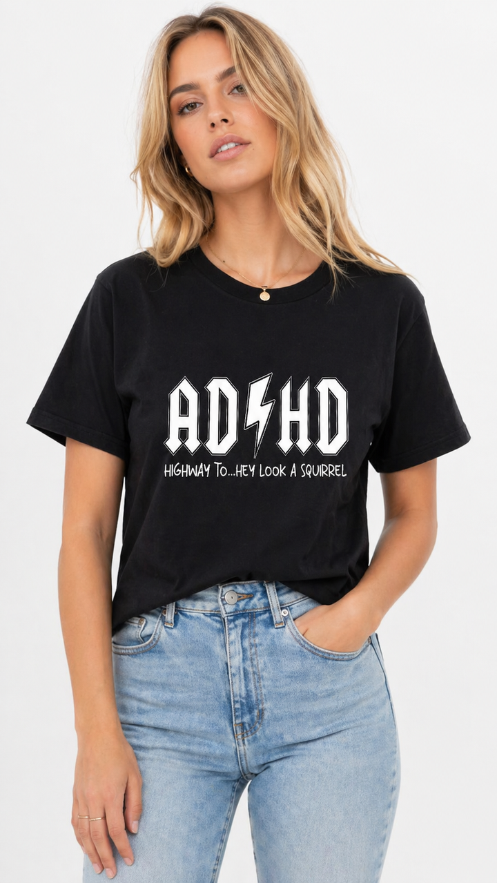 Person wearing a black t-shirt with &