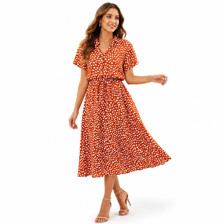 White spotted shirt dress with straw hat, tie waist and flowing midi skirt for elegant summer vacation outfits online looks..
