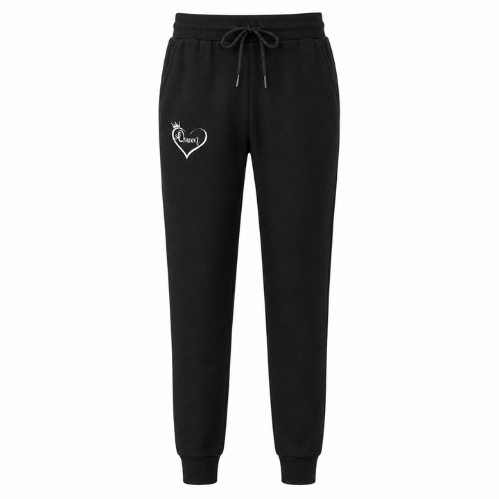 Women black sweatpants with elastic waist, tapered leg cuffs and subtle Queen heart graphic, styled as cozy casual joggers
