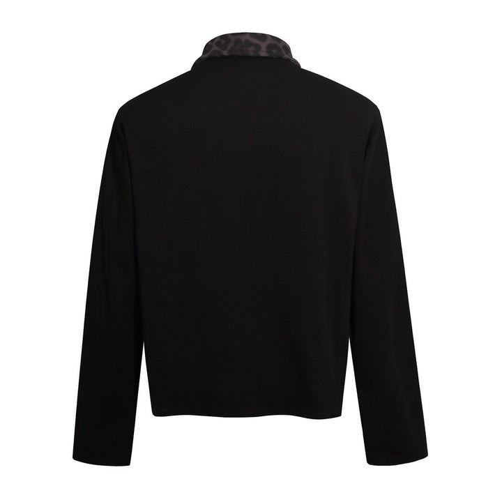 Black long sleeve collared polo shirt shown from the back, with an unprinted body, striped sleeves and dark patterned collar.