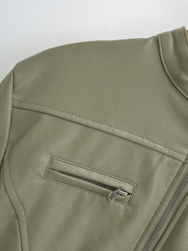 Gray Green jacket chest close-up showing the shoulder panel with the silver chest zipper and faux leather grain in the photo.
