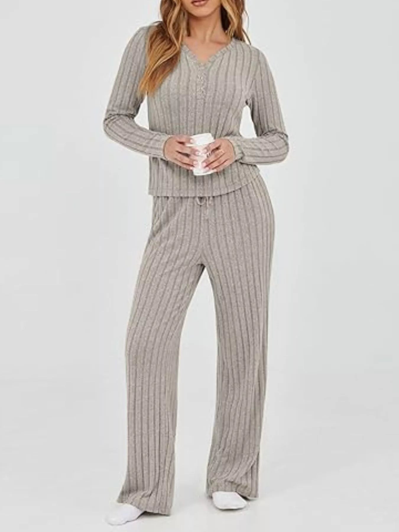 Back View Women's Ribbed Knit Long Sleeve Top and Pants Set Highlighting Stretchy Fit.