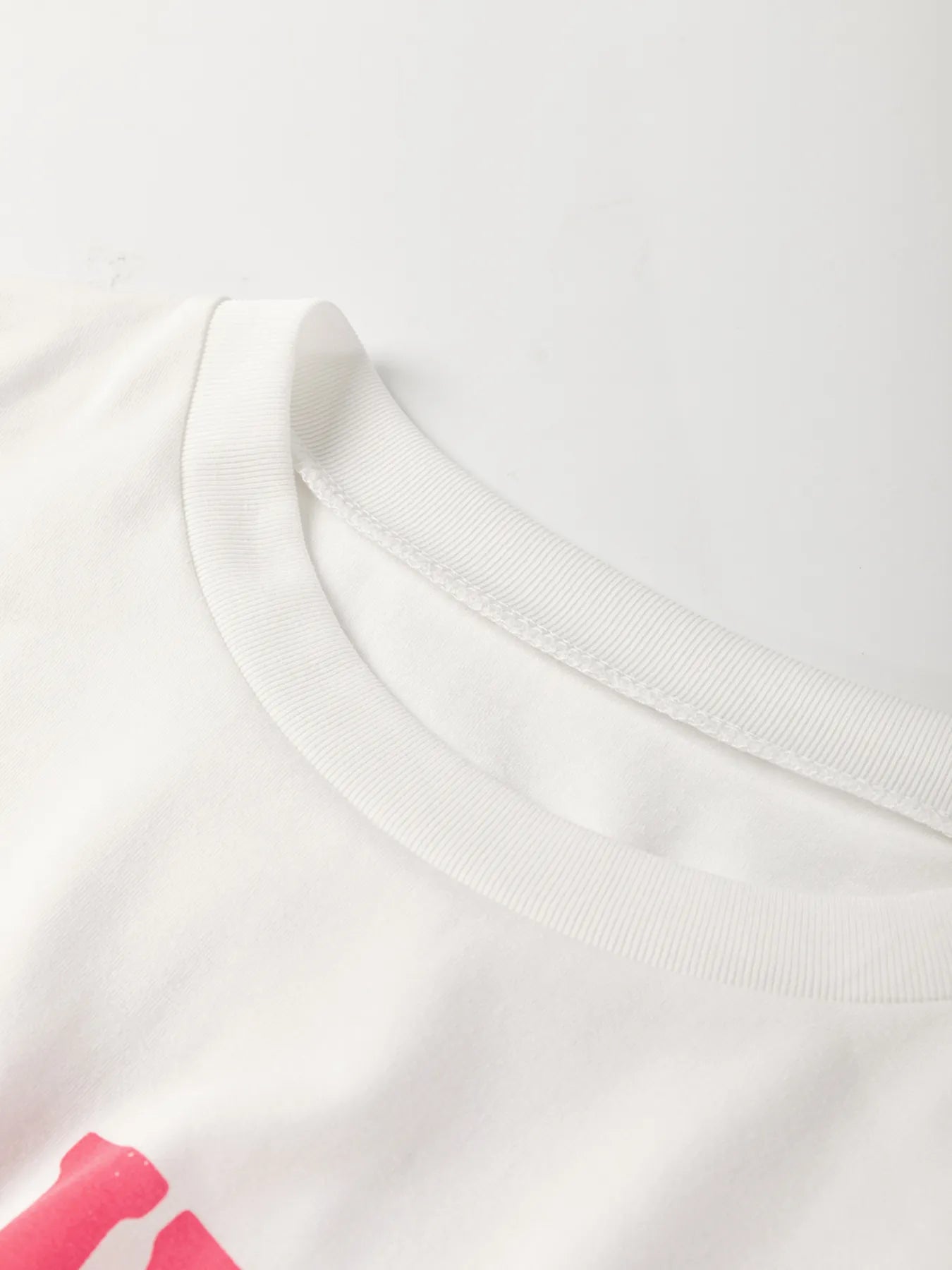 Bold floral “Flower Market T-Shirt” on crisp white cotton canvas

