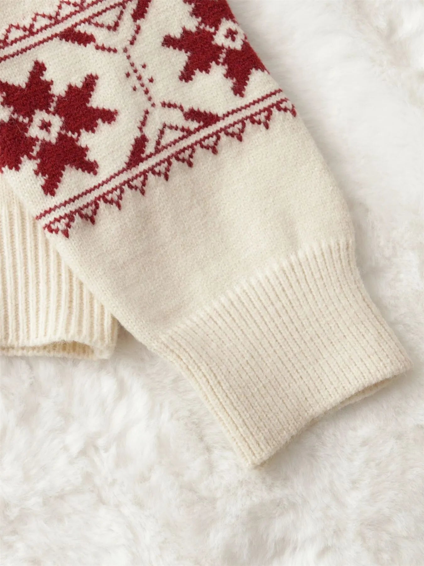 Christmas snowflake sweater – sleeve snowflake graphic and cuff ribbing detail shot