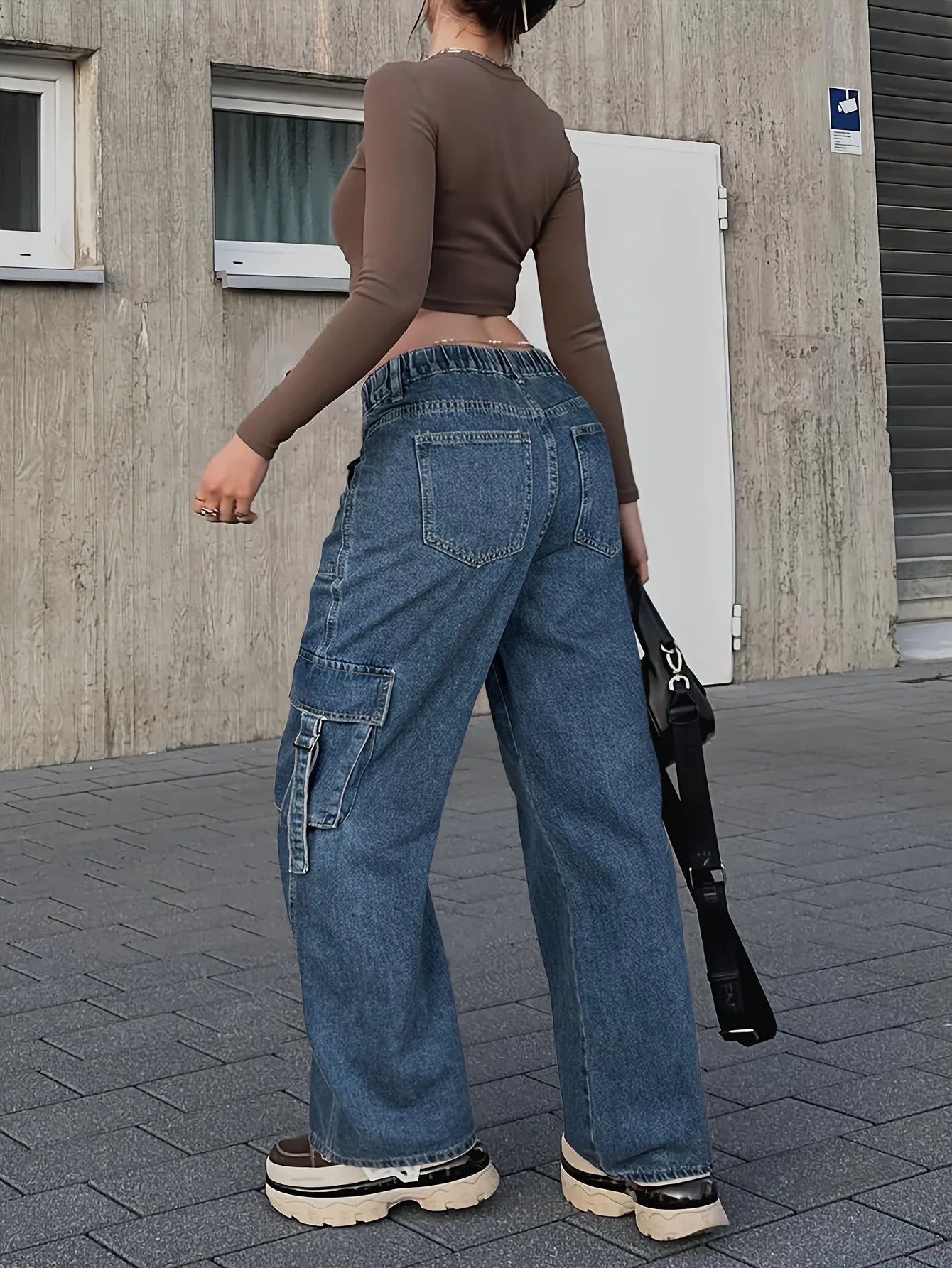 Close-Up on Multi-Pocket Details of Women's Cargo Jeans in Streetwear Fashion