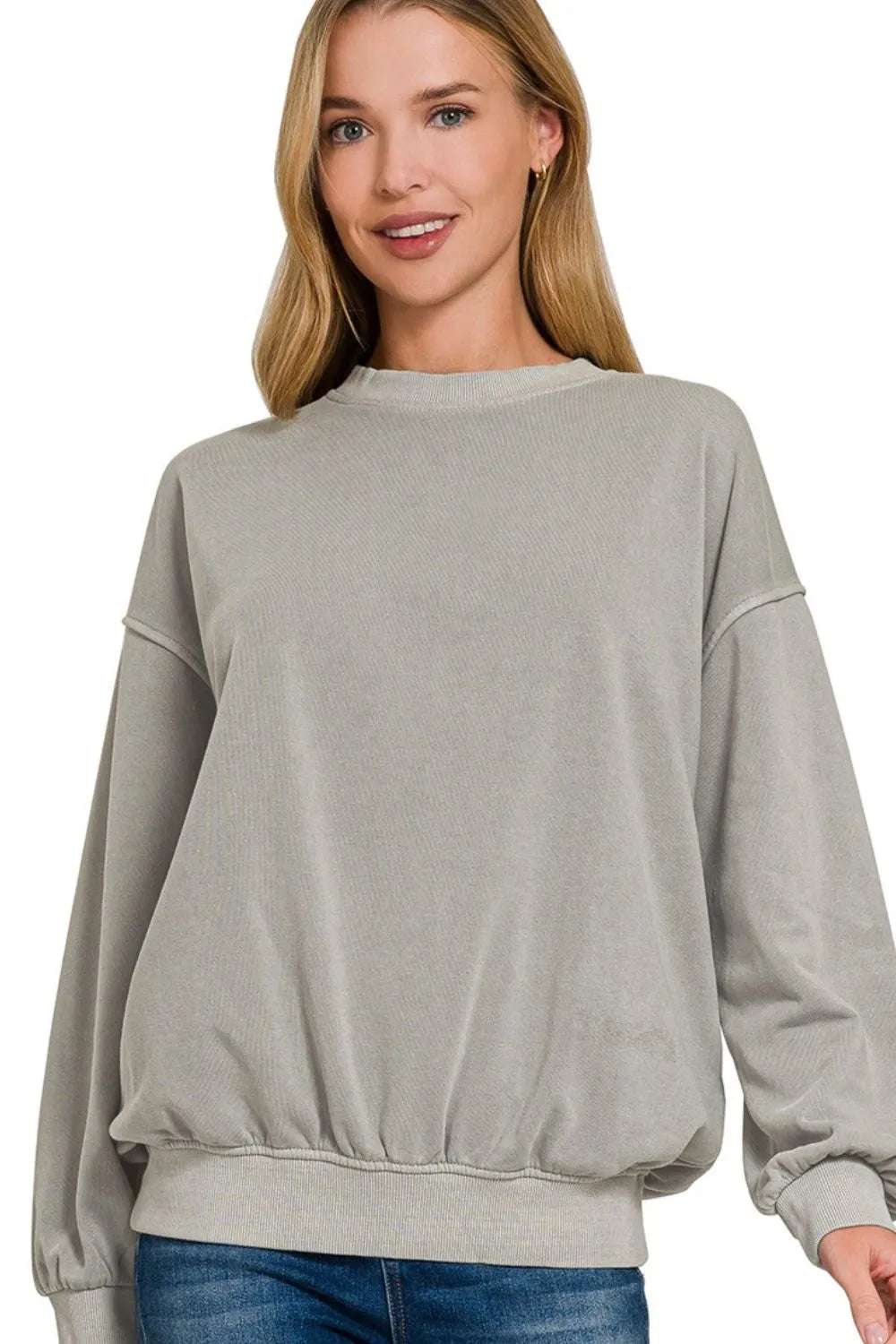 Back view of woman wearing Zenana soft fleece sweatshirt outdoors

