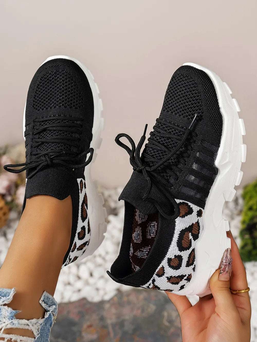 Top-down view of trendy leopard mesh sneakers without box

