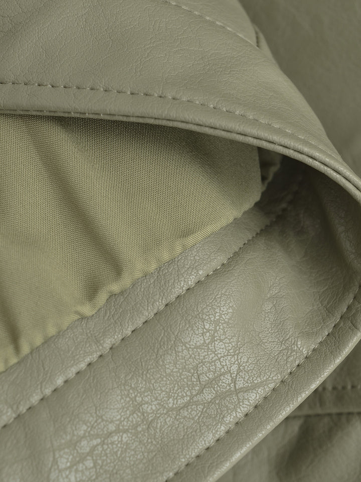 Gray Green jacket inside edge close-up showing the lining with the stitched faux leather edge and inner surface in the photo.