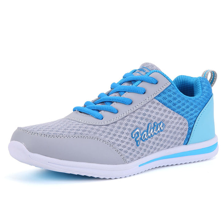 Gray and blue lace-up shoe in a three-quarter view on white, showing blue laces, gray mesh upper, heel loop and a white sole.