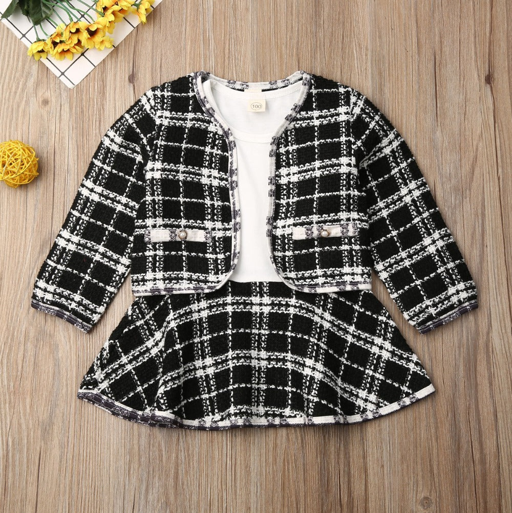 Fashion-forward toddler outfit: Girls Plaid Fall Two-Piece Set with a soft sweater and flirty mini skirt.

