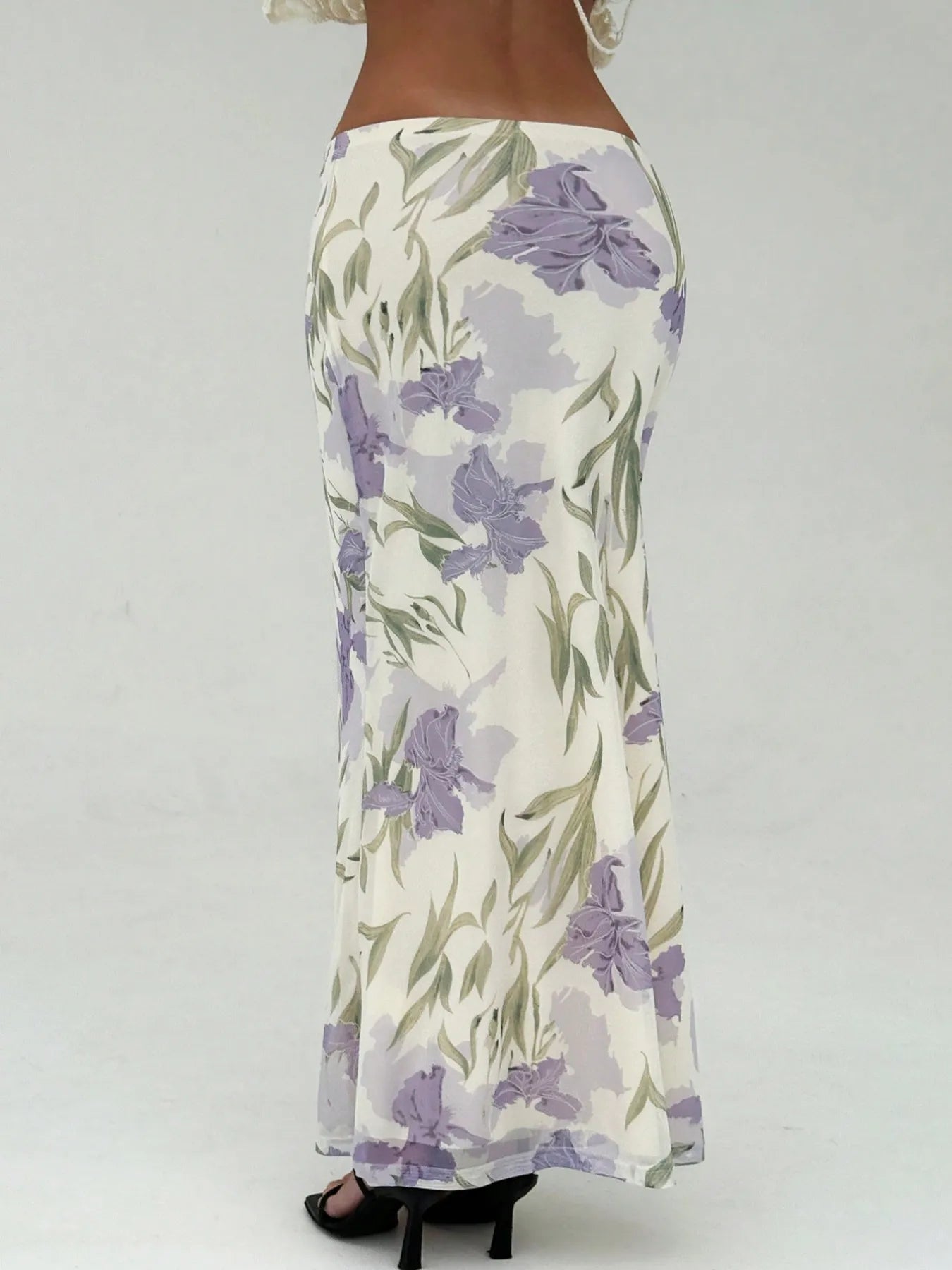 Feminine maxi skirt with high slit wrap design

