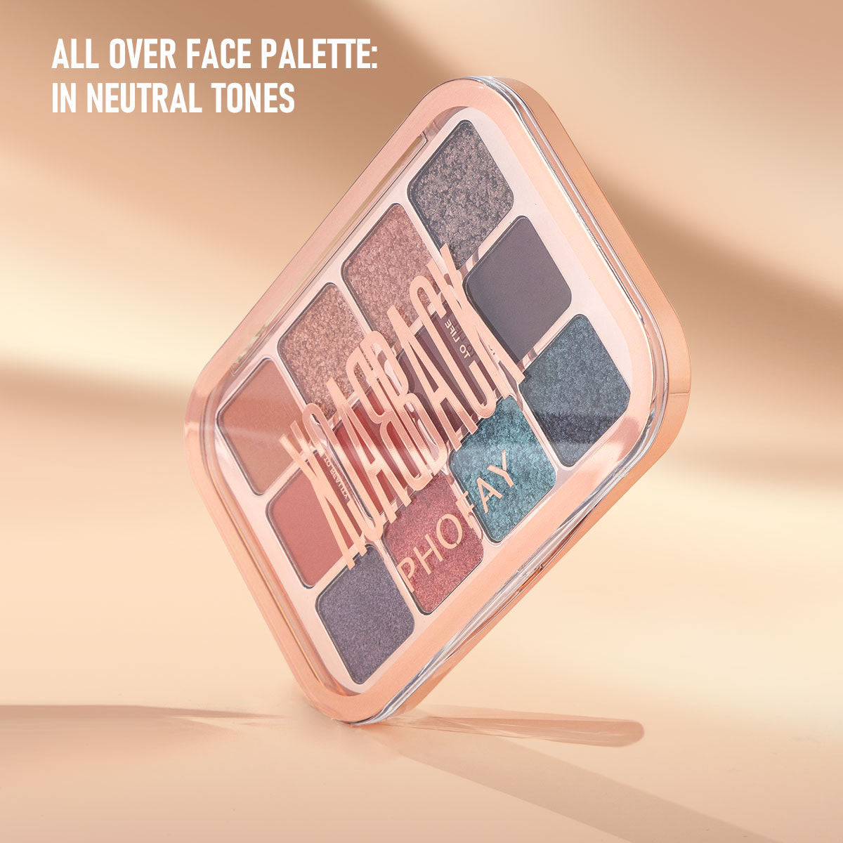 “Flat lay: PHOFAY eyeshadow palette surrounded by brushes and rose-gold accessories”


