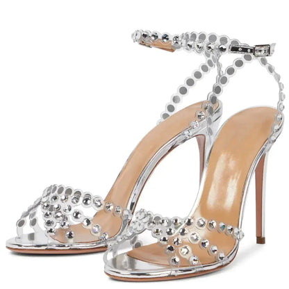 Front angle of PVC ankle-strap sandals with silver rhinestones, open toe, minimal upper, bridal party style.