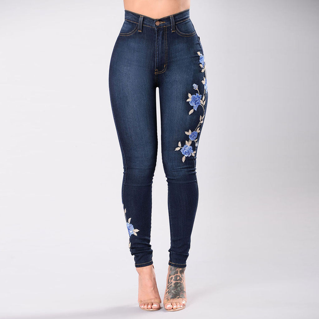 Full-length shot of wide-leg embroidered denim in natural daylight.

