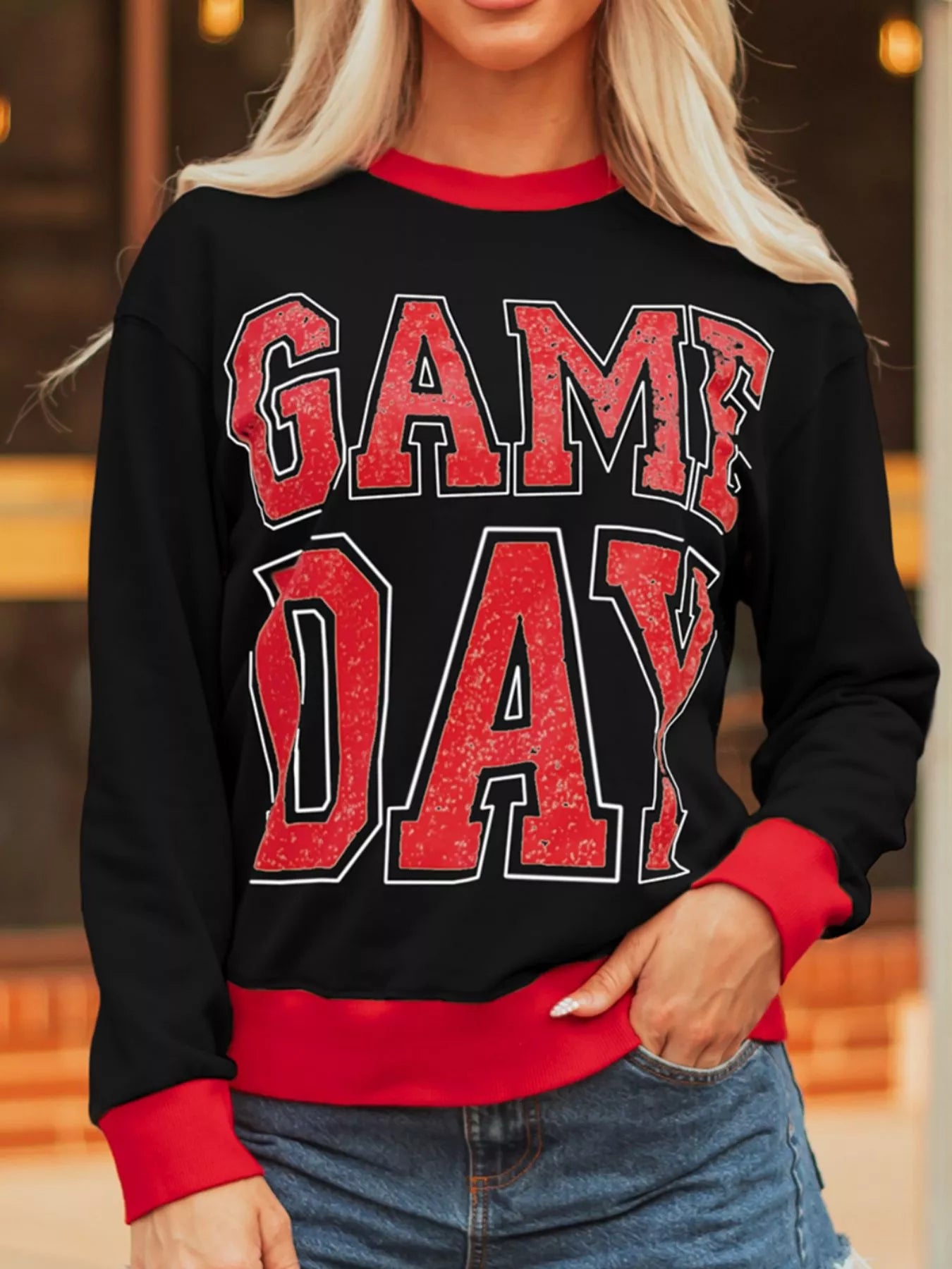 Game Day Varsity Sweatshirt in action – bold letter graphic and striped sleeves for ultimate fan energy