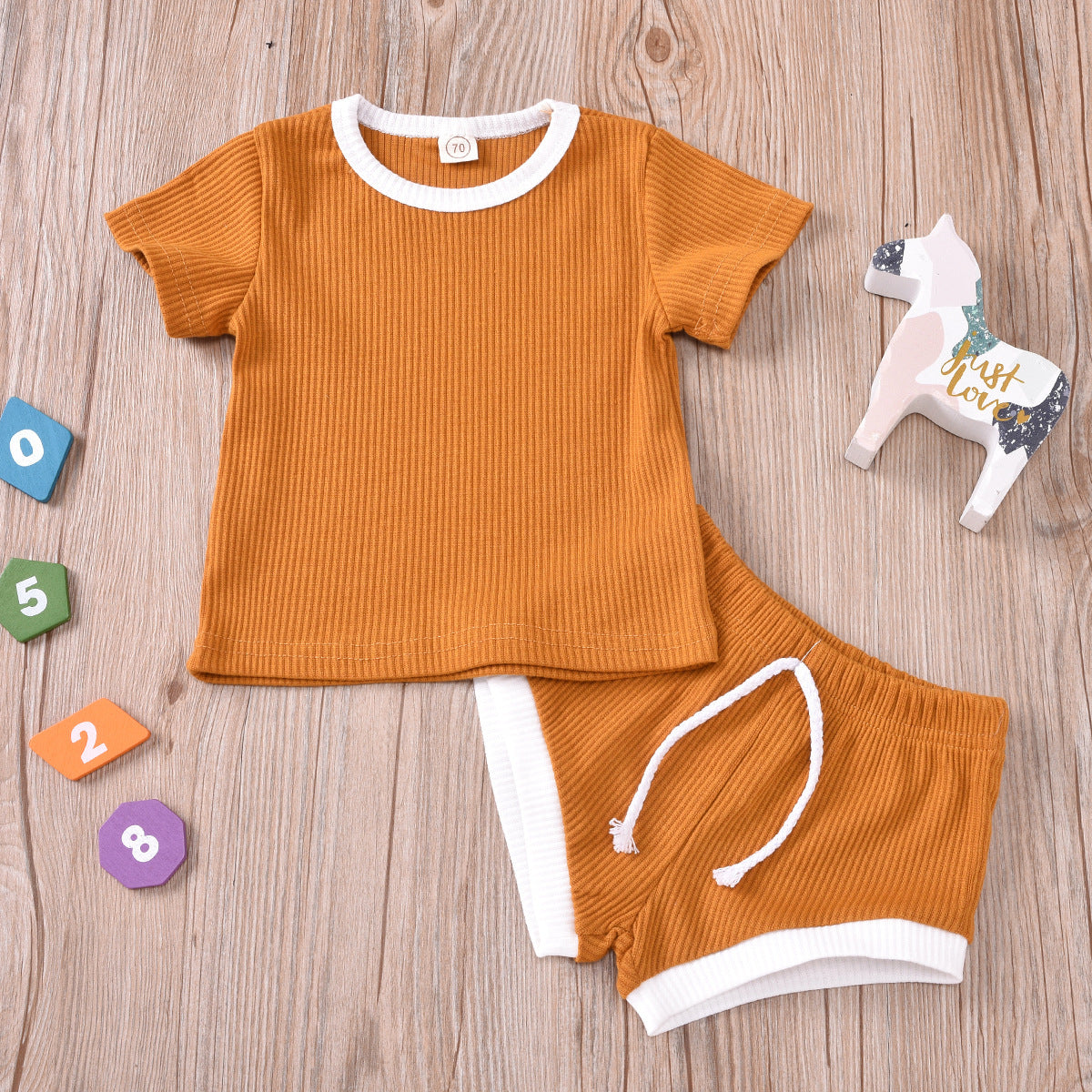 Group shot of various sizes in the infant two-piece set for growing toddlers.