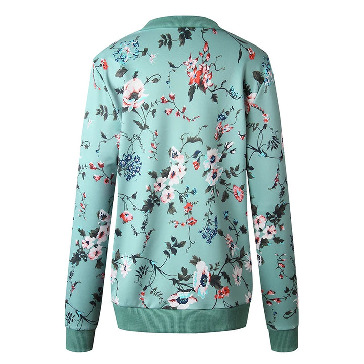 Back product view of the Green printed jacket showing scattered floral blooms, long sleeves and matching green ribbed edging.