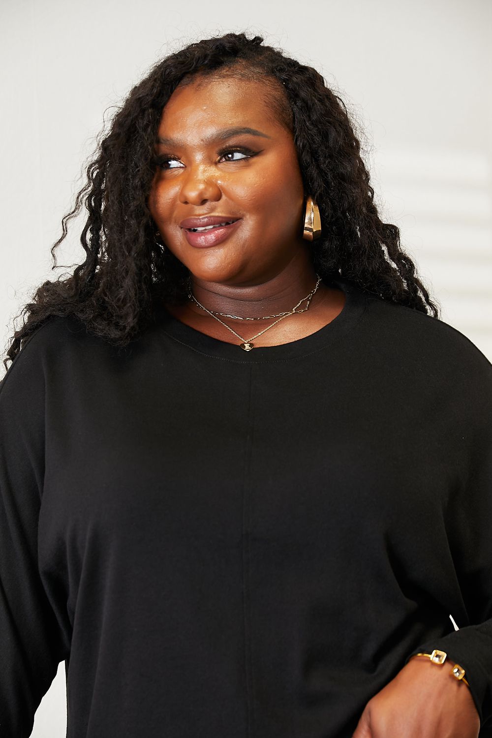 “Layered Look: Seam Detail Top Under a Leather Jacket for Edge”

