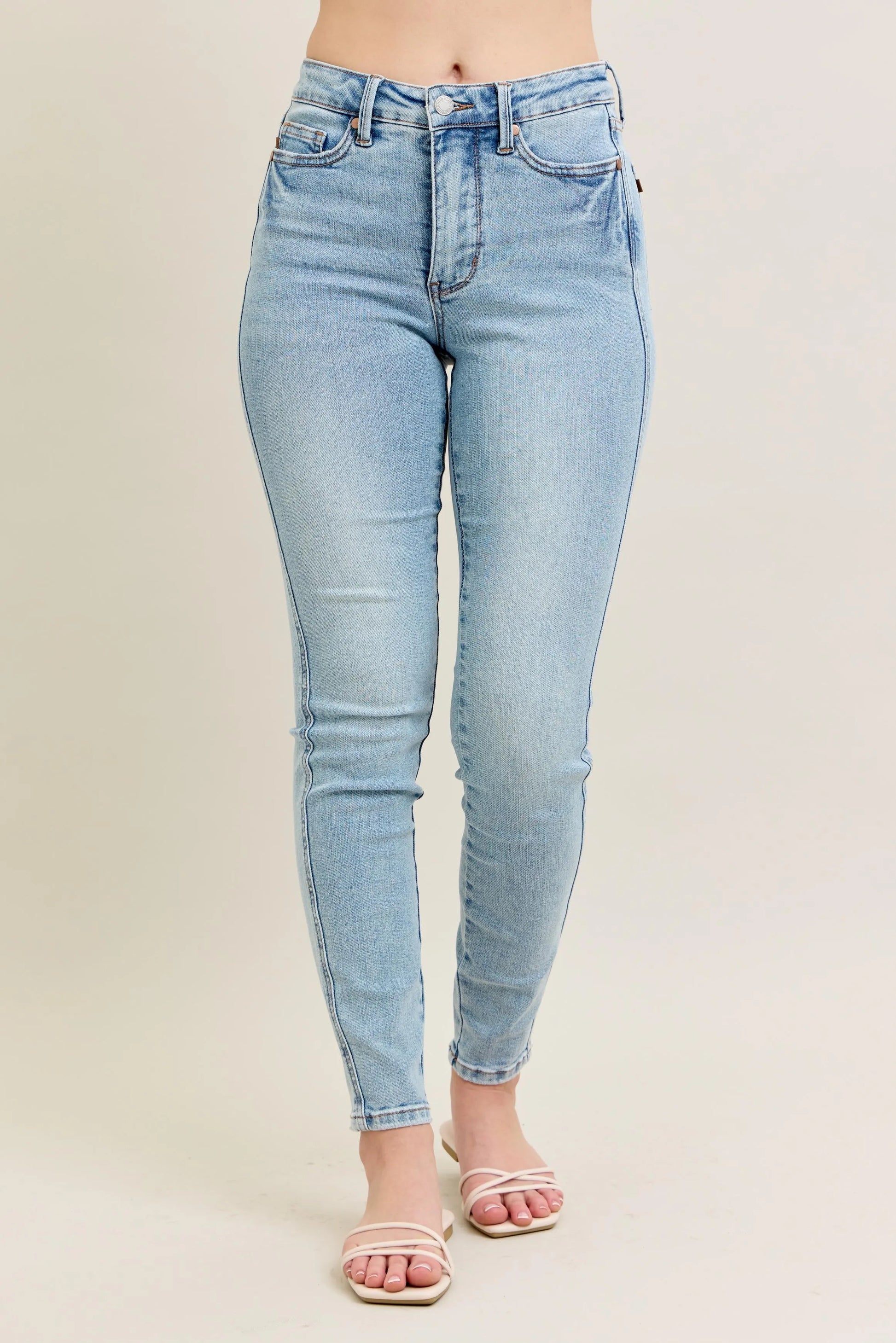 Light blue Sexy Ripped Denim Jacket for Women laid flat to showcase raw-edge hem and pockets.

