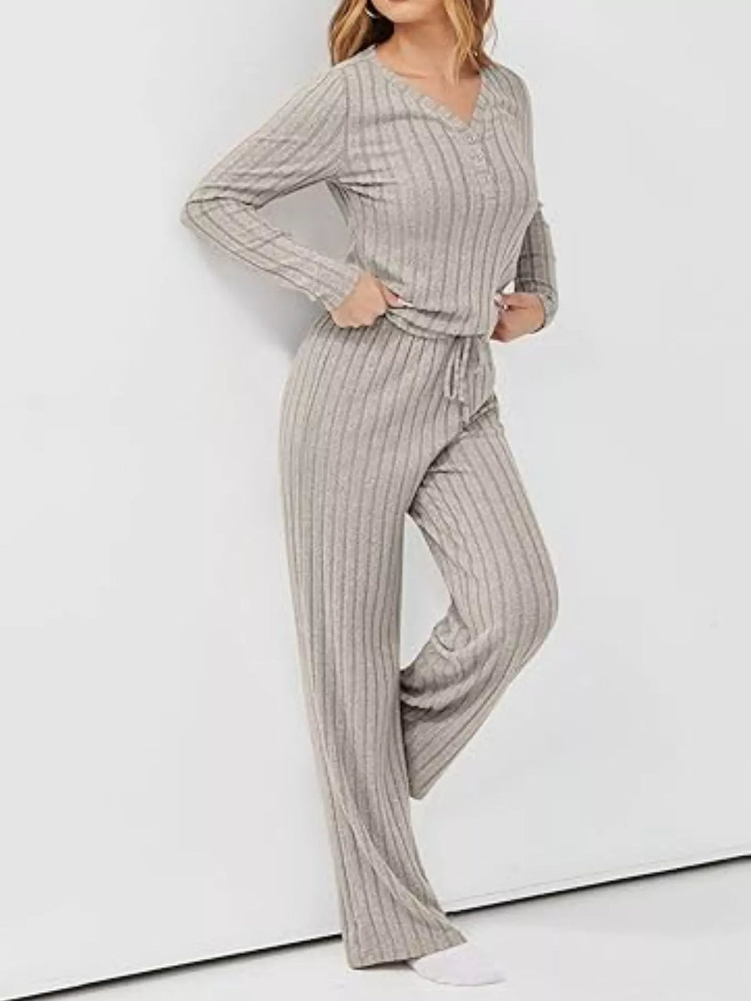 Model Wearing Women's Ribbed Knit Long Sleeve Top and Pants Set in Neutral Tone for Casual Wear.