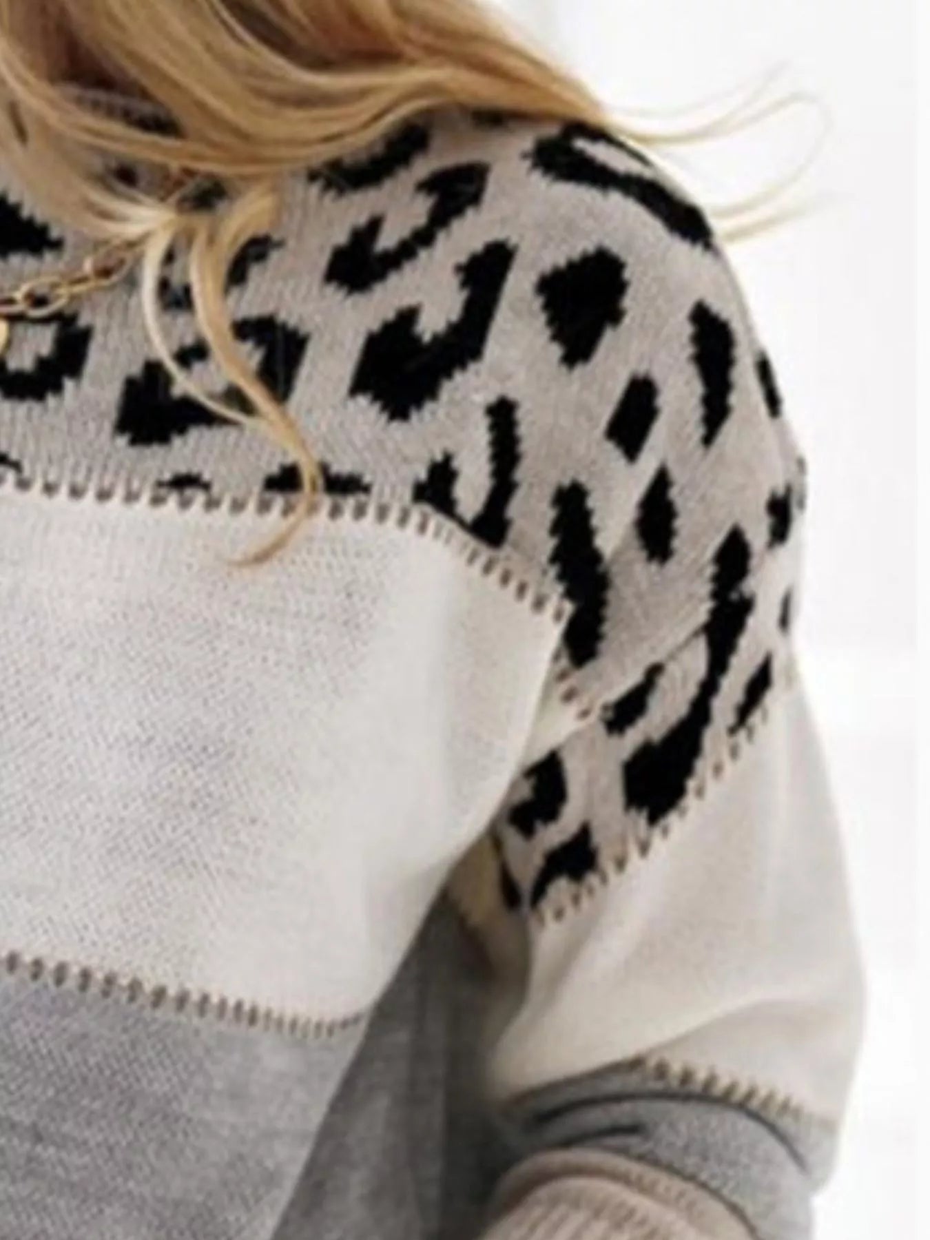 Model wearing spotted top with camel trousers