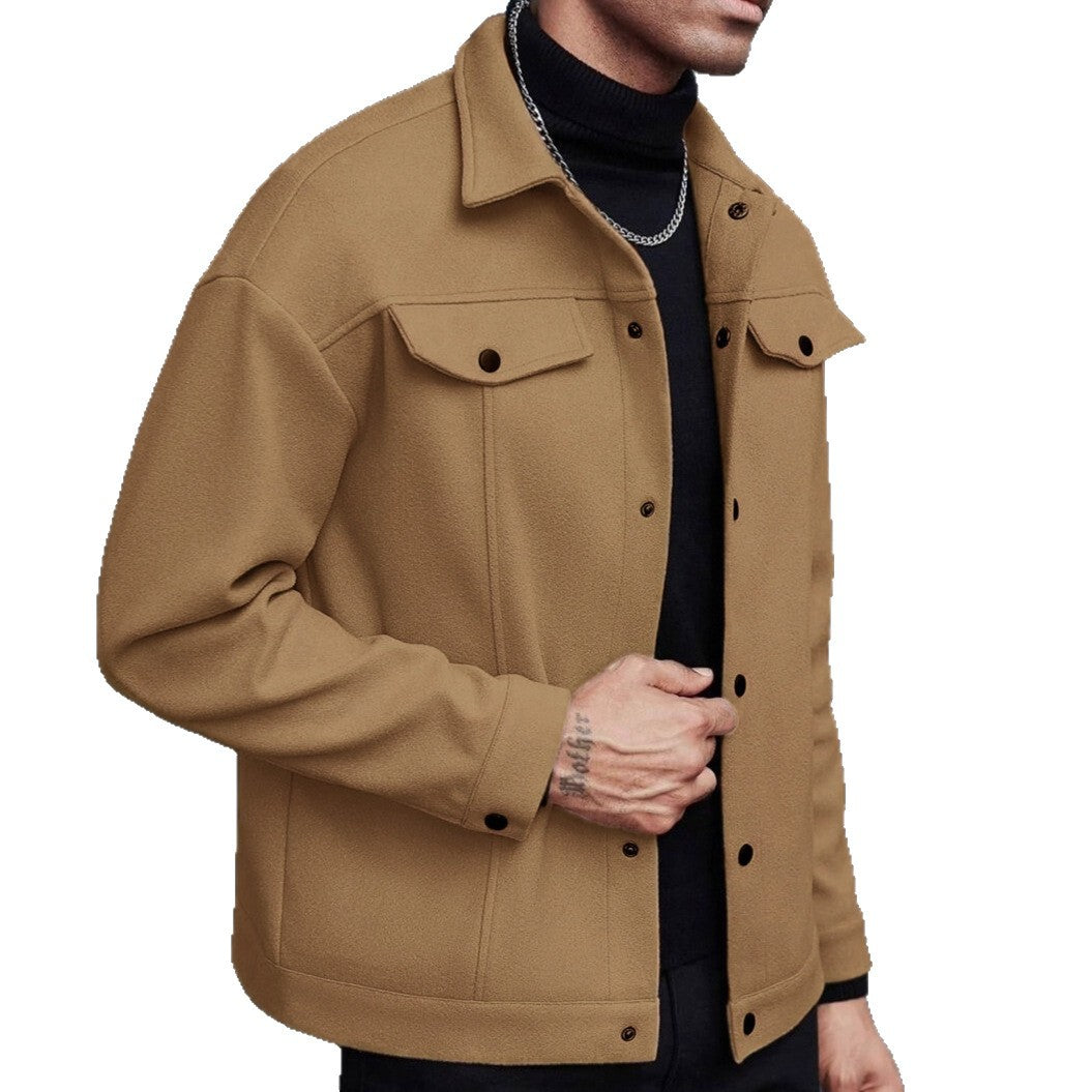 Earthy yellow jacket on a cropped model, showing a pointed collar, flap chest pockets and snap front on the white background.