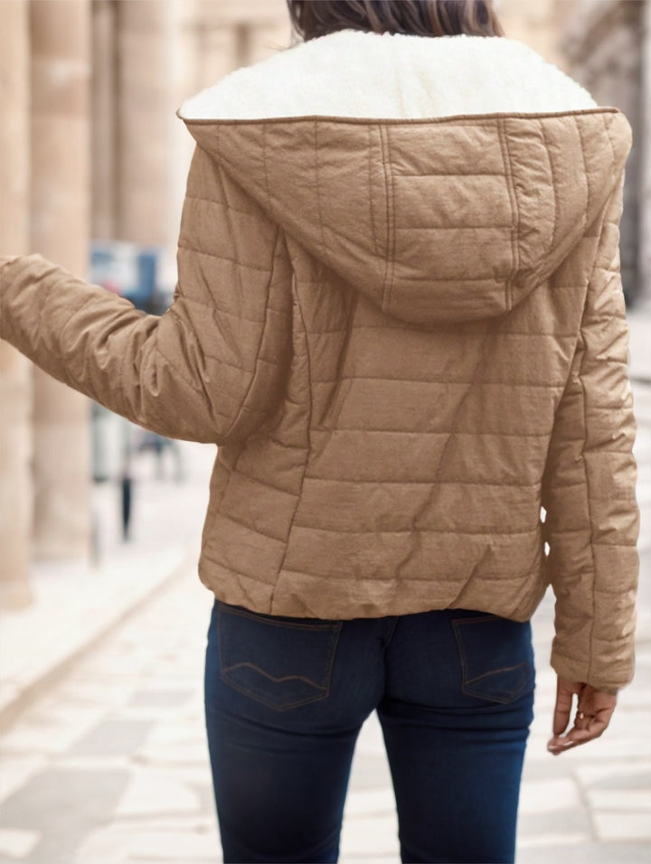Office-to-out: women’s padded coat layered over knitwear