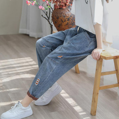 Orange Ripped Ninth Jeans for Casual Cool Vibes