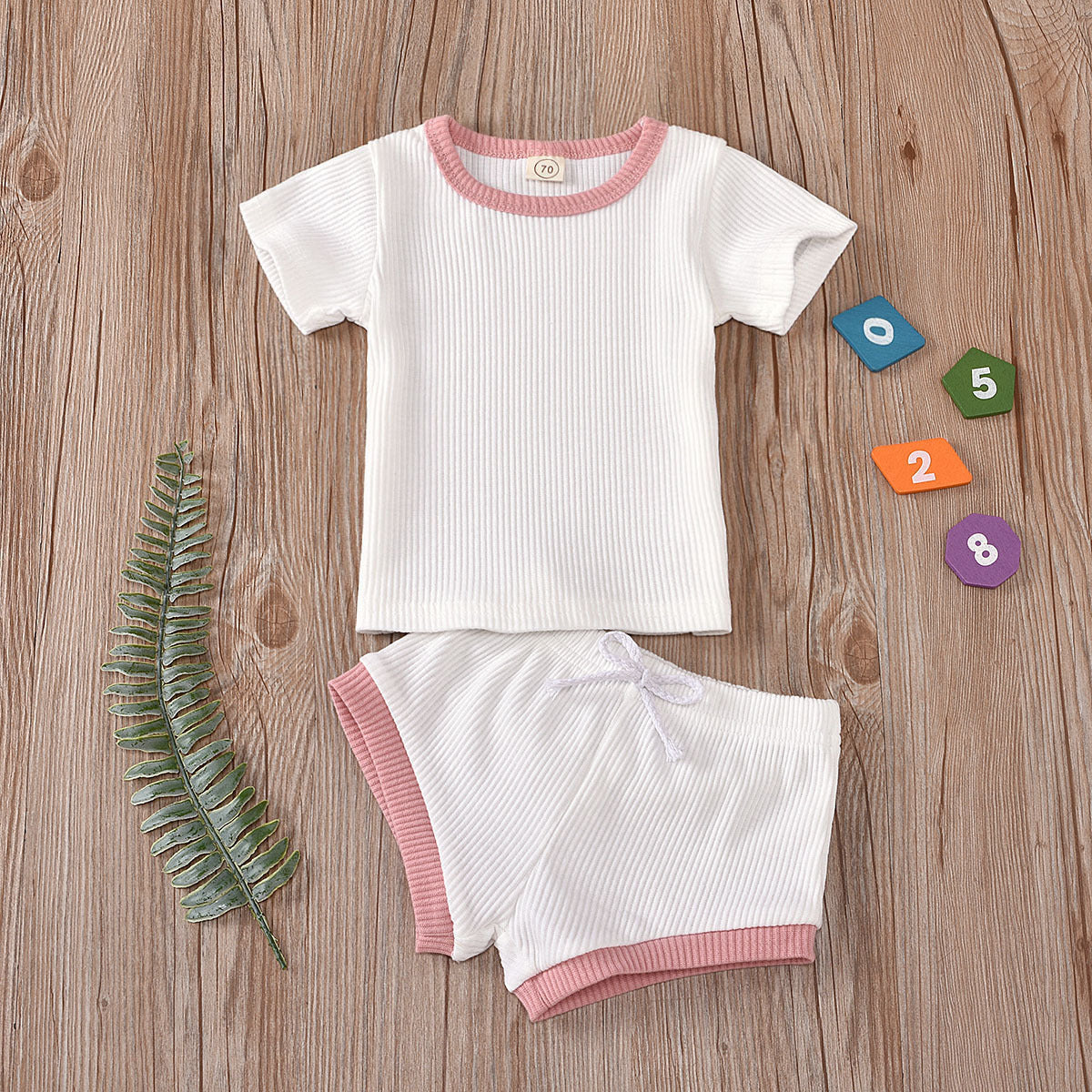 Parent-approved comfort in our non-hooded infant two-piece set ensemble.