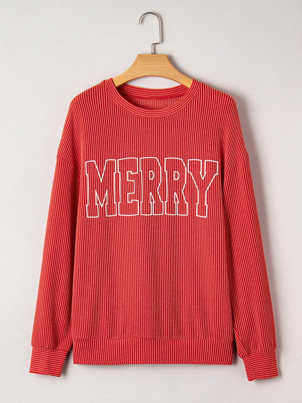 Ribbed Christmas top layered under coat – winter styling