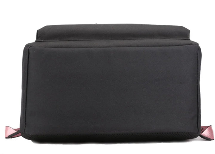 Bottom view of black reference school backpack, showing its rectangular fabric base, seams and black construction in a photo.