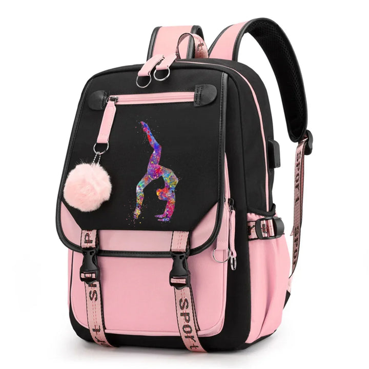 Pink and black backpack in design 1D-35-14 with a colorful gymnast print, buckle straps and pink pendant, shown against white