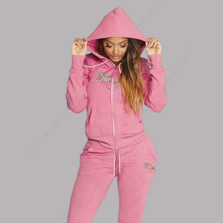 Matching set detail with hooded top and drawstring pants in the verified polyester fleece fabric type.