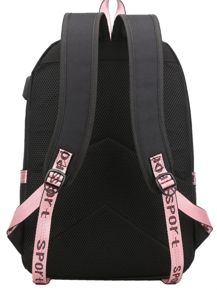 Rear view of the black bag showing its two shoulder straps, pink adjustment webbing, top handle and textured mesh back panel.