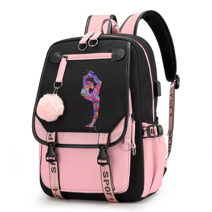 Pink and black backpack in design 1D-35-4 with a colorful gymnast print, buckle straps and pink pendant, shown against white.