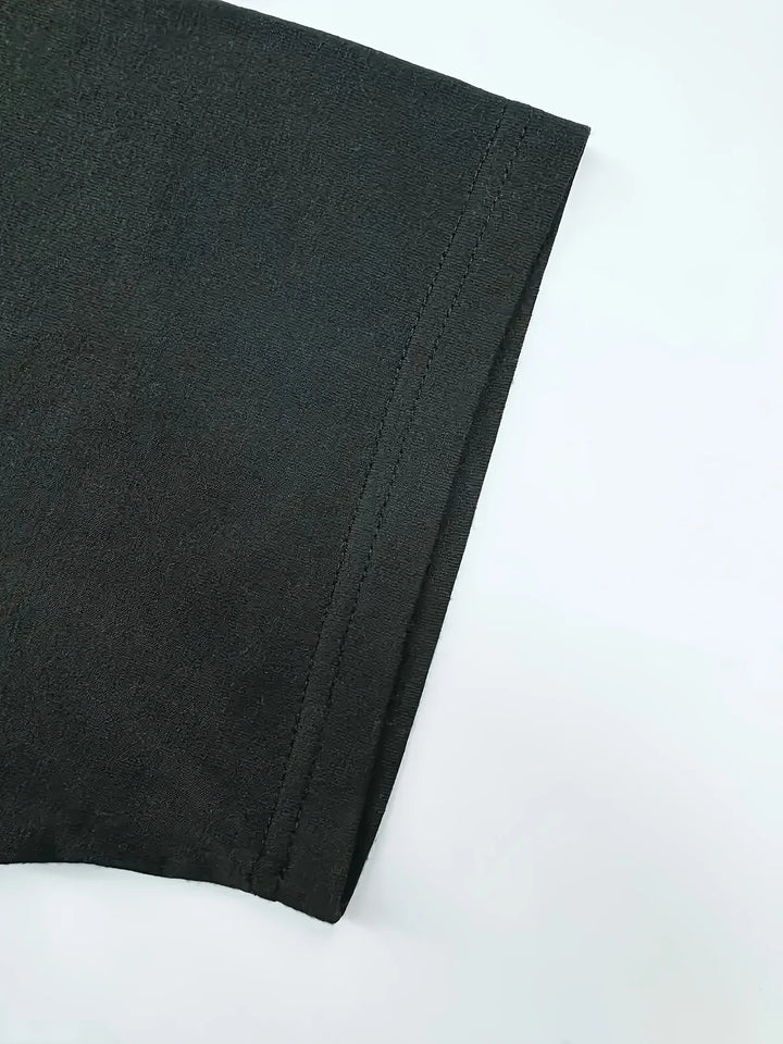 Original detail photo of the black sleeve hem and stitching