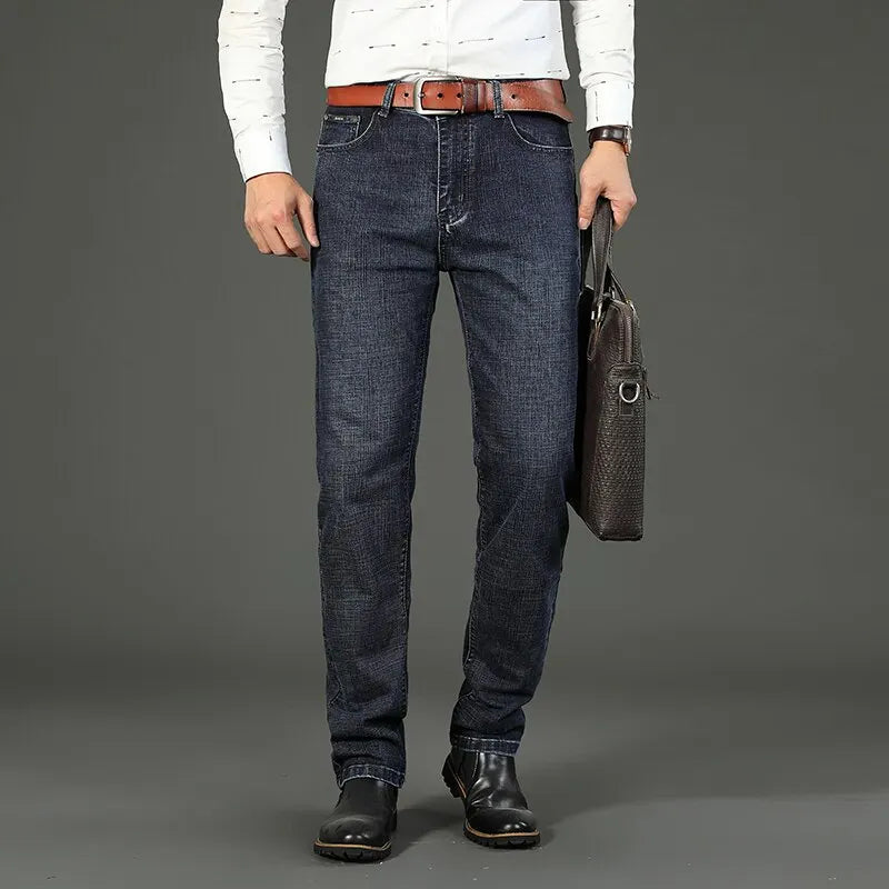 "business casual men's jeans dark blue stretch denim styled with shirt and blazer for work meeting"